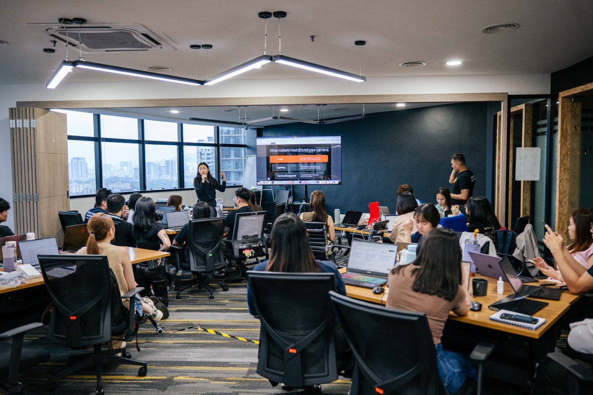 Wide shot of the Story ARC™ workshop with teams working at their stations